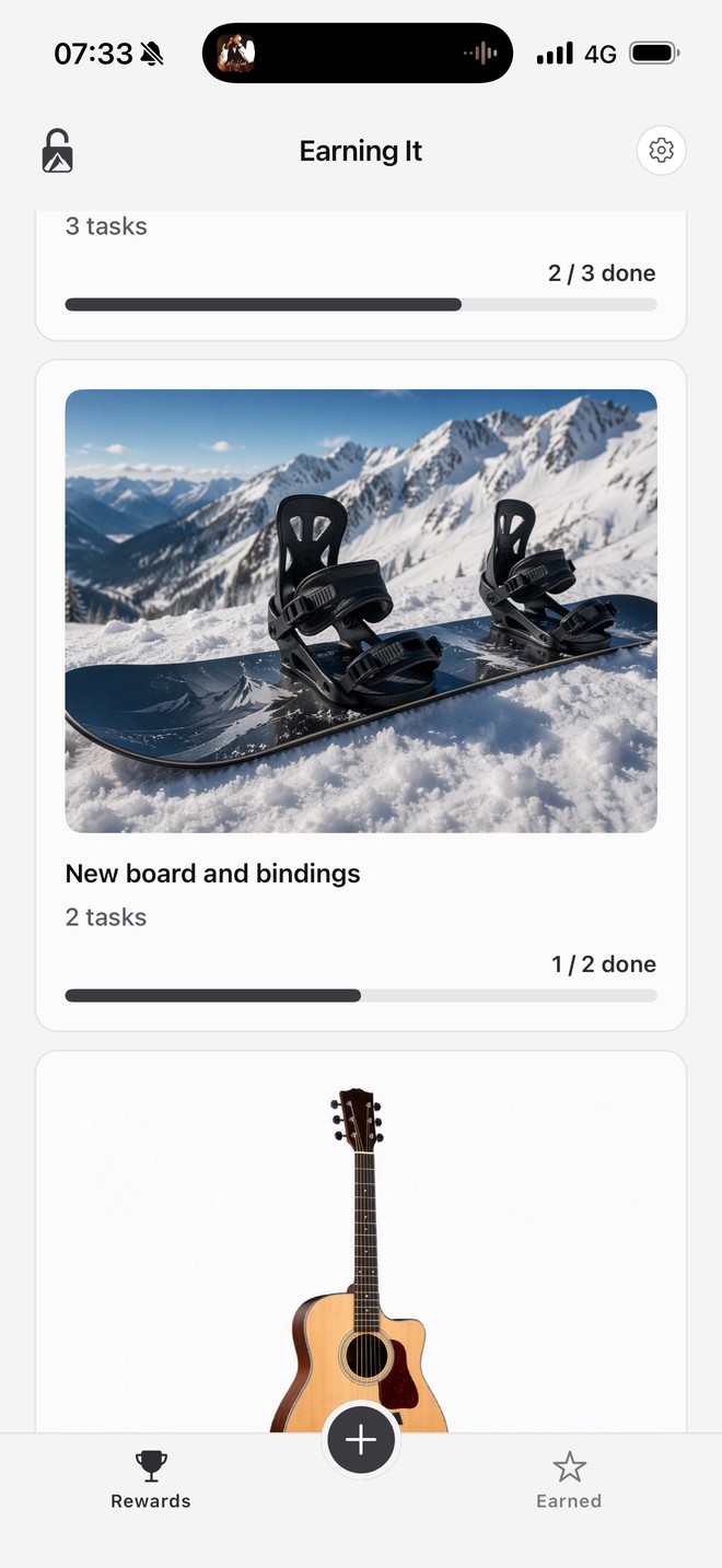 Earning It home screen in the Light theme showing the snowboard reward card at 1 of 2 tasks done